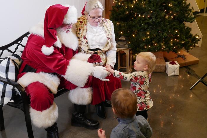 Keith and Melanie Hubbard, who portray Santa and Mrs. Claus in Oklahoma greet their grandchildren in 2019.