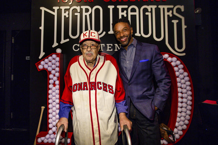 Negro Leagues baseball veteran Jim Robinson and ESPN/ABC correspondent Ryan Smith attend an event celebrating 100th anniversary of the league in New York in February.