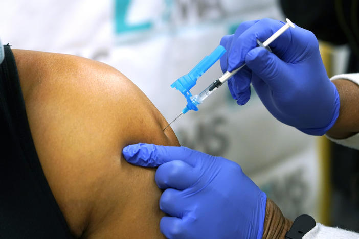 Health care workers have been throwing out the excess vaccine, fearing it would be against FDA rules to use it.