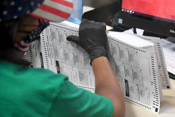 A former Houston police captain was charged Tuesday with allegedly running a man off the road and pointing a gun at his head in an attempt to prove his claims of a voter fraud conspiracy.