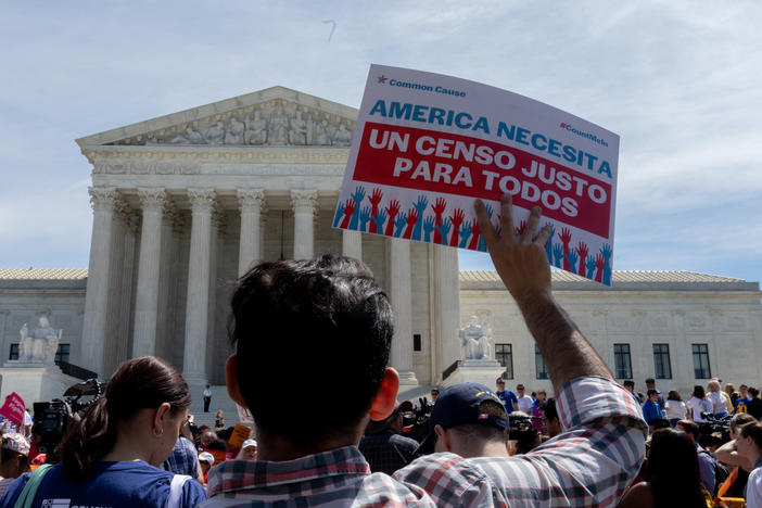Protesters carrying signs about the census gather outside the U.S. Supreme Court in 2019. Immigrant rights advocates have vowed to continue fighting President Trump's proposal.
