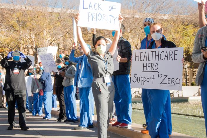 Medical residents and fellows protest the university's vaccine allocation process outside Stanford Hospital on Friday morning in Palo Alto, Calif.