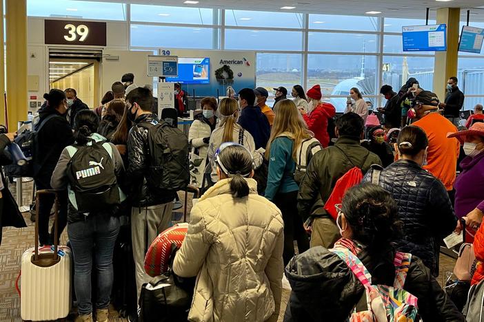Crowds are seen at Washington's Reagan National Airport on Friday. More than a million people went through airport security each of the past two days, despite the coronavirus pandemic.