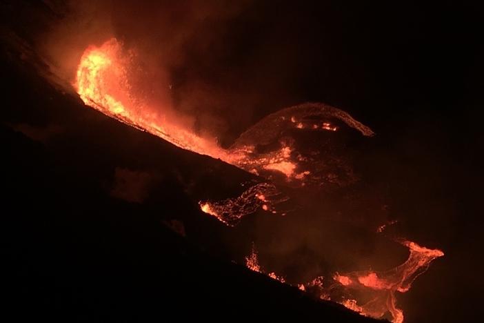 Lava cascades into the summit water lake at the Kilauea volcano on Hawaii's big island. The eruption began late Sunday within the volcano's Halemaumau crater, at the summit of Kilauea.