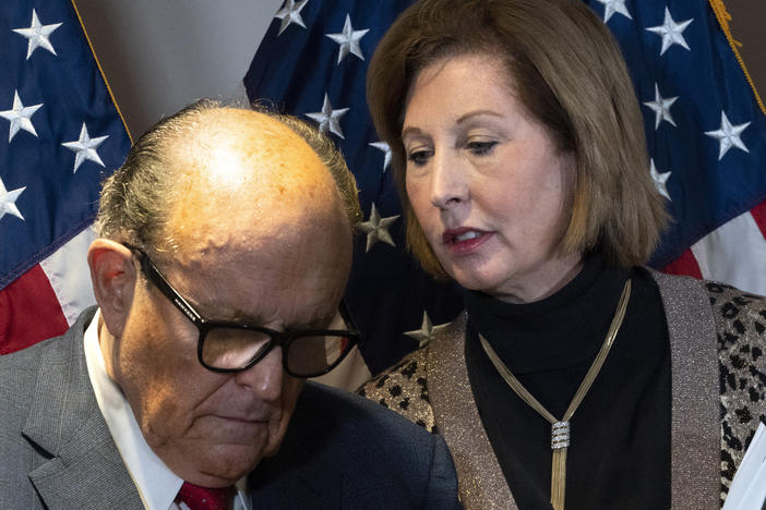Rudy Giuliani, President Trump's personal attorney, with lawyer Sidney Powell last month in Washington. They, the Trump campaign and others face a lawsuit by an employee of Dominion Voting Systems, a vendor that has been the subject of disinformation from Trump and his allies.