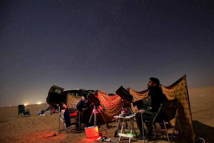 Kuwaiti photographers follow the alignment in al-Salmi district, a desert area about 75 miles west of Kuwait City.
