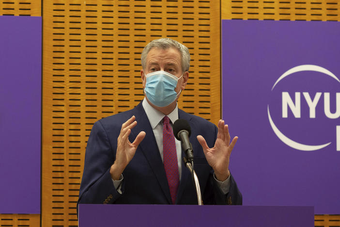 New York City Mayor Bill de Blasio announced that sheriff's deputies will be deployed to enforce quarantine protocols for travelers arriving from the United Kingdom. The mayor is seen above on Dec. 14. while delivering remarks ahead of the first COVID-19 vaccinations at NYU Langone Hospital.