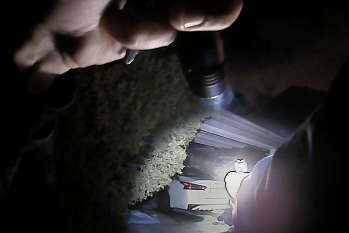 This image from a Columbus police body camera shows the moments before Officer Adam Coy fatally shoots Andre Maurice Hill early Tuesday.