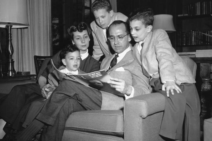Dr. Jonas E. Salk, who discovered the polio vaccine, reads with his wife and three boys in Ann Arbor, Mich., on April 11, 1955. The boys were among the first vaccinated during testing. The family was photographed the night before an announcement the vaccine was effective. Pictured from left are Jonathan, 5; Donna Salk; Peter, 11; Salk; and Darrell, 8.