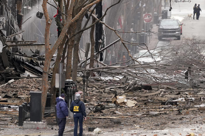 Emergency personnel work near the scene of an explosion in downtown Nashville, Tenn., on Dec. 25.