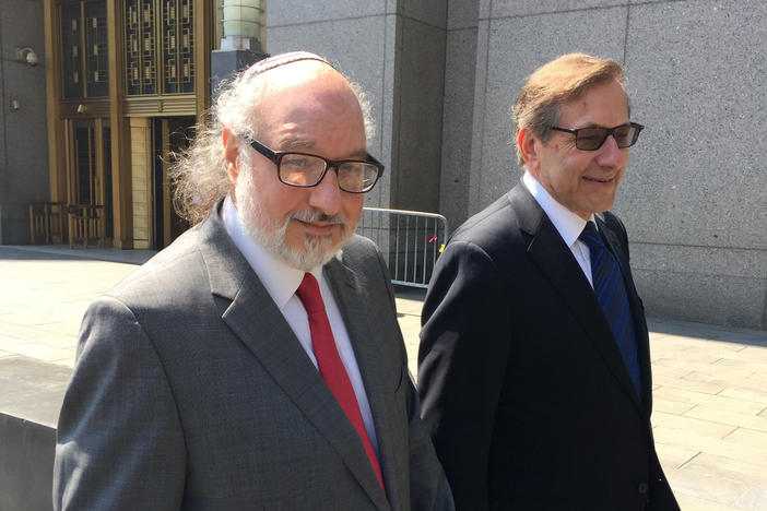 Convicted spy Jonathan Pollard, left, with his lawyer, Eliot Lauer, leaves federal court in New York following a 2016 hearing. The former U.S. Navy analyst who spent three decades in prison after pleading guilty to spying for Israel, has arrived in Israel a month after the Justice Department allowed his parole to expire.