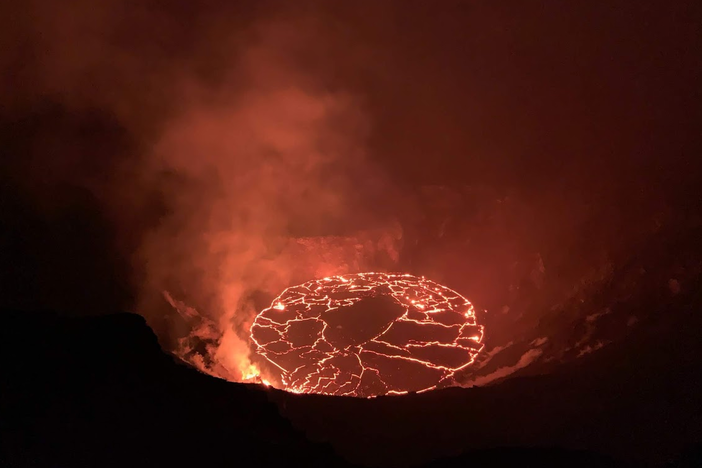 Crews observe the continuing eruption in Halema'uma'u at Kilauea in the early morning of Dec. 28. Overnight, the western vent in the wall of Halema'uma'u continued to erupt.