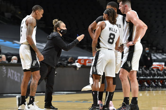 San Antonio Spurs assistant coach Becky Hammon made NBA history Wednesday, becoming the first woman to lead a team in the regular season. She's seen here talking to her players as they faced the Los Angeles Lakers at the AT&T Center in San Antonio.
