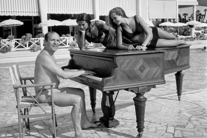 A shot of jazz pianist Claude Bolling and friends, taken on a beach in Cannes, France in 1969.