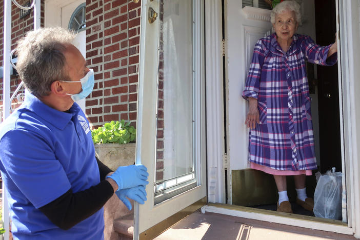 Homebound senior Louise Delija, 93, receives a meal delivery in Brooklyn, New York. Since the pandemic began, demand for help from seniors has ballooned.