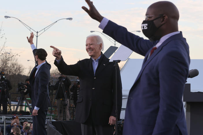 President-elect Joe Biden campaigns alongside Democratic Senate candidates Jon Ossoff (left) and the Rev. Raphael Warnock on Monday in Atlanta.