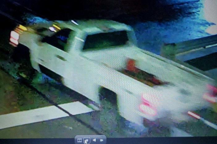 Police are looking for a white truck in connection with an incendiary device thrown from a moving vehicle, which damaged a parked car Sunday night in Pittsburgh's Lawrenceville neighborhood.