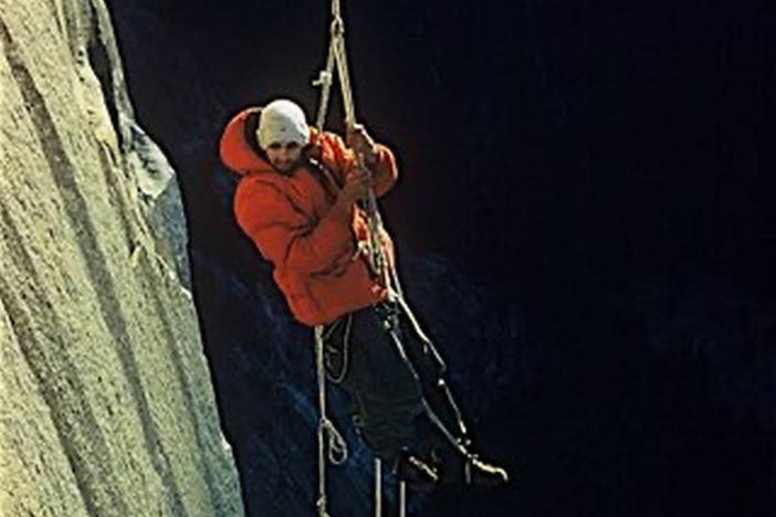 This photo by climbing partner Wayne Merry and provided by the Whitmore Family Trust shows George Whitmore dangling off an outcropping during the historic first ascent of El Capitan in Yosemite National Park in 1958.