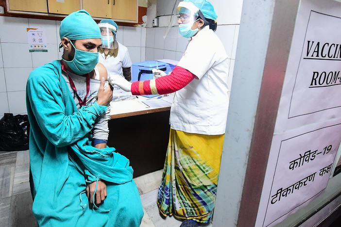 Volunteers and health officials hold a dry run for the coronavirus vaccine at a hospital in Allahabad, India. There's concern that drug patents will keep lower income countries from getting the doses they need in a timely fashion.