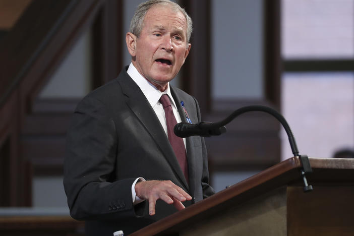 Former President George W. Bush said he was sickened and heartbroken at the "mayhem" transpiring at the U.S. Capitol on Wednesday. Bush is seen here in July 2020 at the funeral of Rep. John Lewis.