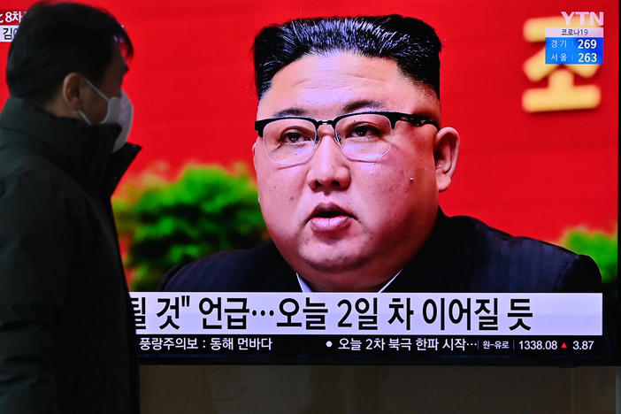 A man watches a television screen showing news footage of North Korean leader Kim Jong Un attending the 8th congress of the ruling Workers' Party held in Pyongyang, at a railway station in Seoul on Wednesday.