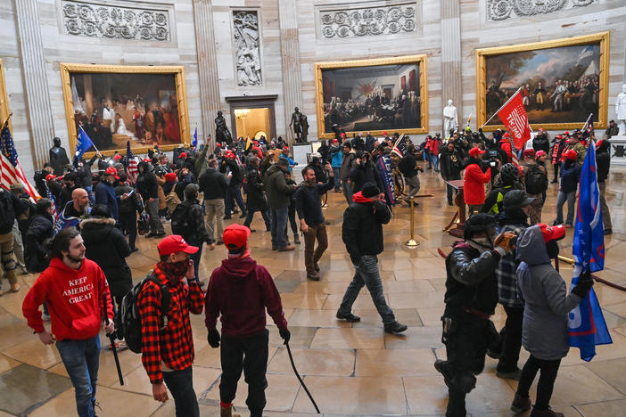 Supporters of President Trump roam the U.S. Capitol Rotunda after storming into the building on Wednesday.