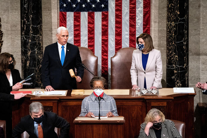 Vice President Pence and House Speaker Nancy Pelosi, D-Calif., preside over a joint session of Congress to ratify President-elect Joe Biden's 306-232 Electoral College win over President Trump, hours after a pro-Trump mob broke into the U.S. Capitol and disrupted proceedings.