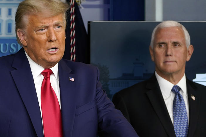 President Trump speaks in the press briefing room in November as Vice President Pence listens behind him.