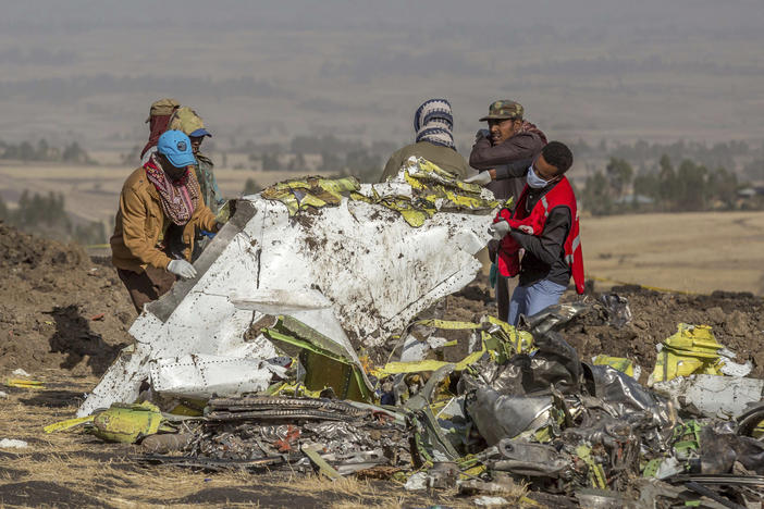 Rescuers work at the scene of an Ethiopian Airlines Boeing 737 Max that crashed near Bishoftu, or Debre Zeit, south of Addis Ababa, Ethiopia, in March 2019.