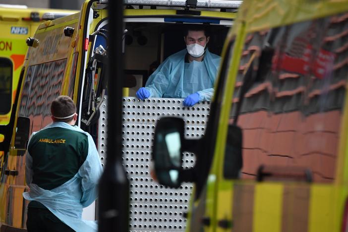 Paramedics prepare an ambulance outside the Royal London Hospital on Friday. Mayor Sadiq Khan has declared a "major incident," warning that hospitals in the British capital could soon be overwhelmed after a surge in coronavirus infections.