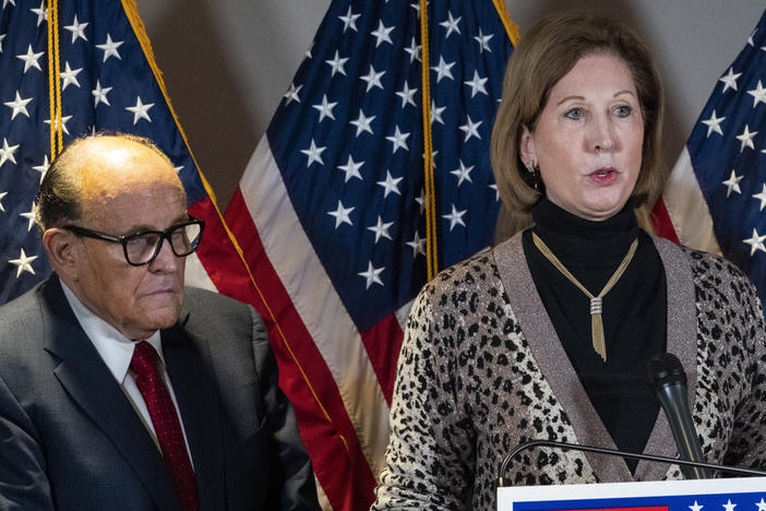 Sidney Powell, right, speaks next to former New York Mayor Rudy Giuliani in November in Washington.