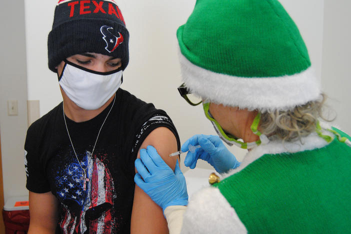 Gene Bracegirdle is relieved to get his first dose of the vaccine recently in rural Colorado.