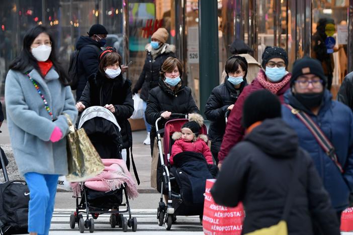 People walk through a busy shopping area amid the coronavirus pandemic on Jan. 5 in New York City. Coronavirus cases are up in almost every state.