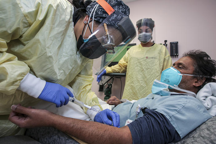 Nurse Salina Padilla prepares an infusion of a COVID-19 antibody treatment at Desert Valley Hospital in Victorville, Calif., in December.