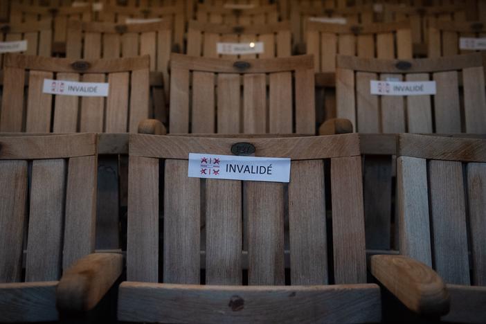 A photo shows seats with stickers to respect social distancing due to the COVID-19 pandemic, in the Theatre de l'Archeveche in Aix-en-Provence, southern France, on July 23, 2020.