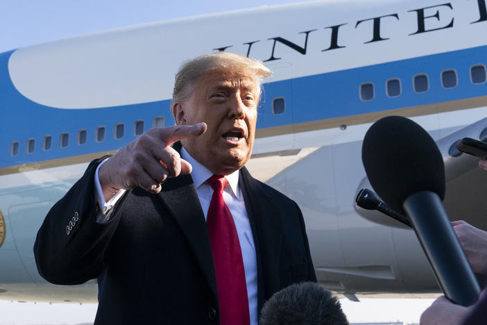 President Trump speaks to reporters before boarding Air Force One on Tuesday. Trump denied culpability for the violence and expressed no regret for comments made last week that many have criticized as being a catalyst for mob violence at the U.S. Capitol.