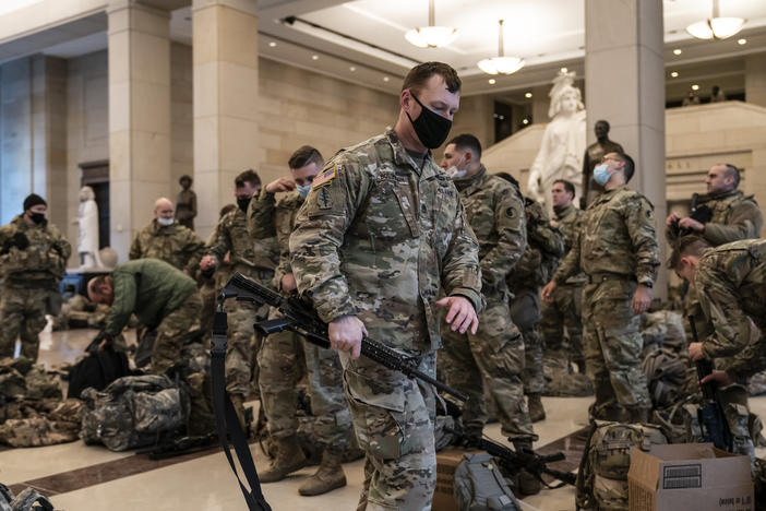 National Guard troops are inside the U.S. Capitol Visitor Center to reinforce security Wednesday at the Capitol in Washington. It comes a week after an insurrection at the Capitol.