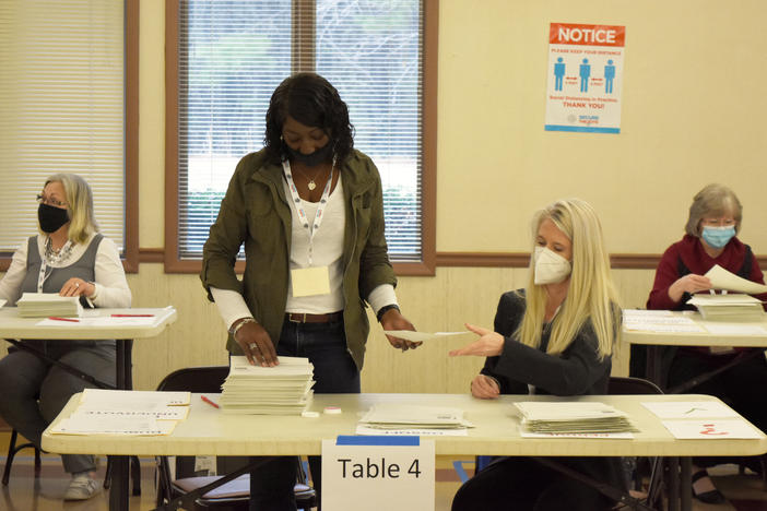 Bartow County, Ga. election workers conduct a full hand count of ballots in the Jan. 5 Senate runoff between former Sen. David Perdue and Sen.-elect Jon Ossoff as part of a voluntary recount aimed at improving voter confidence.