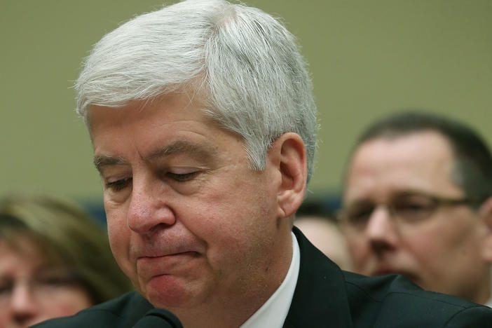 Now Former Michigan Gov. Rick Snyder, (R-MI), listens to Congressional members remarks during a House Oversight and Government Reform Committee hearing, about the Flint, Mich. water crisis in 2016.