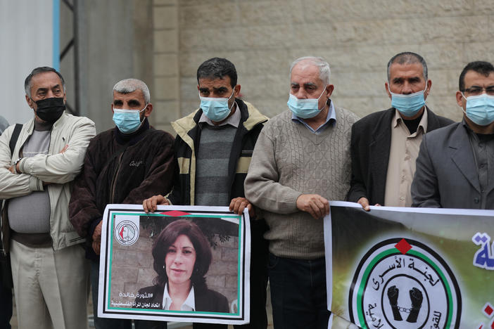 Members of the Palestinian Prisoner Society stage a demonstration outside the International Committee of the Red Cross building, demanding the World Health Organization put pressure on Israeli authorities to vaccinate Palestinian prisoners in Israeli jails, earlier this month in Gaza City.