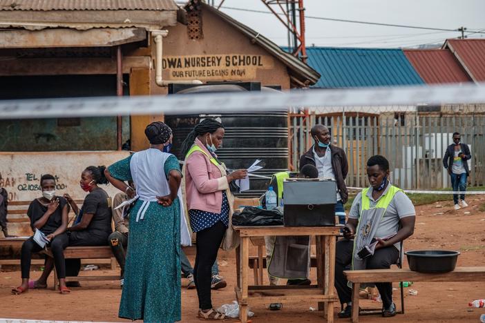 Ugandan election commission officials count ballots after the polls closed at a polling station in Kampala on Thursday.