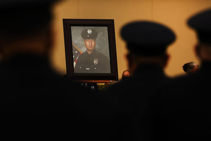 Colleagues, family and friends attend the August funeral of Los Angeles police Officer Valentin Martinez, the agency's first sworn officer to die of complications from COVID-19.