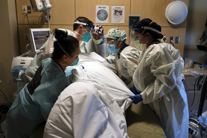 Medical personnel prone a COVID-19 patient last November at Providence Holy Cross Medical Center in the Mission Hills section of Los Angeles.