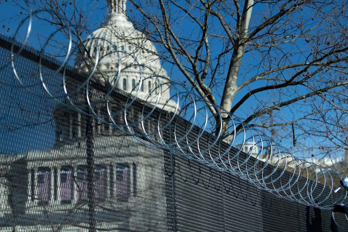 Enhanced security measures, among them razor wire atop a security fence surrounding the U.S. Capitol, are being implemented across the nation in preparation for next week's presidential inauguration.