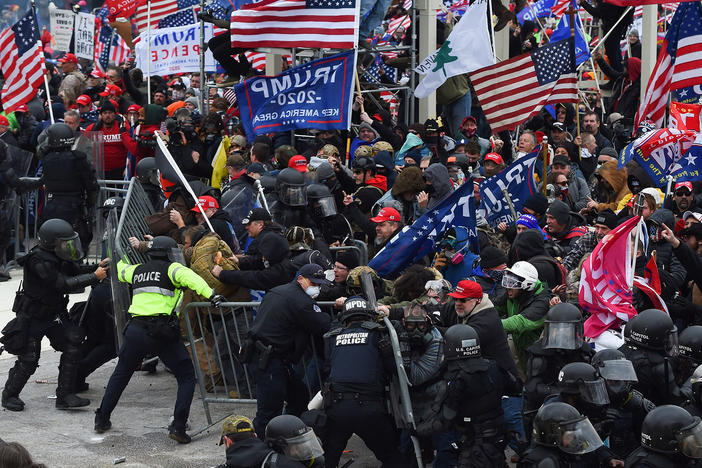 Pro-Trump supporters breeched security and stormed the U.S. Capitol on Jan. 6, 2021. Federal authorities as well as several local departments are looking into whether any off-duty officers were involved in the attack.