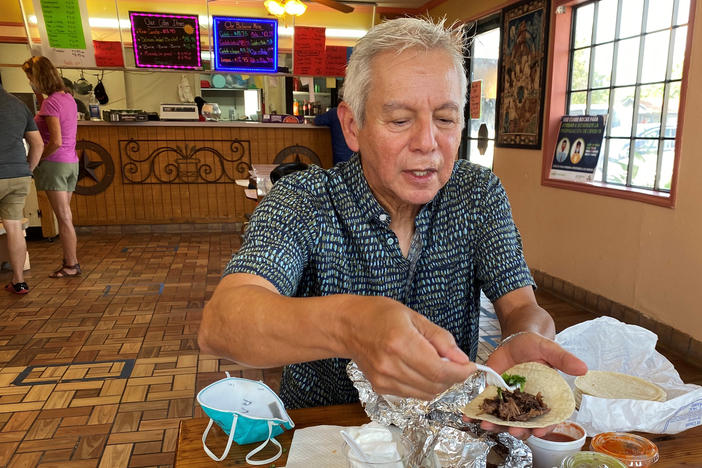 Adán Medrano, chef and food writer, savors a beef cheek taco at Vera's Backyard Bar-B-Que in Texas' Rio Grande Valley.