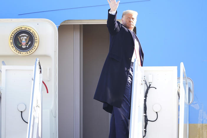 President Trump waves while boarding Air Force One at Joint Base Andrews before a Jan. 12 trip. He's planning a departure ceremony there on Wednesday, while skipping the traditional send-off at the Capitol.