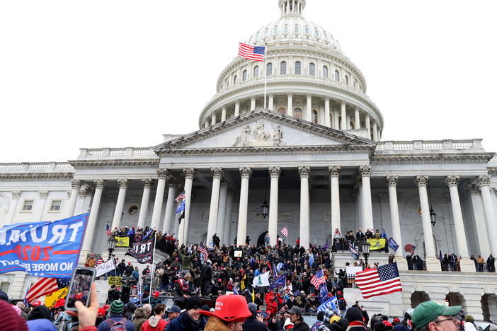 Pro-Trump protesters seeking to force Congress to overturn the election results swarm the U.S. Capitol on Jan. 6, two weeks before President-elect Joe Biden is scheduled to gives his inaugural address there.