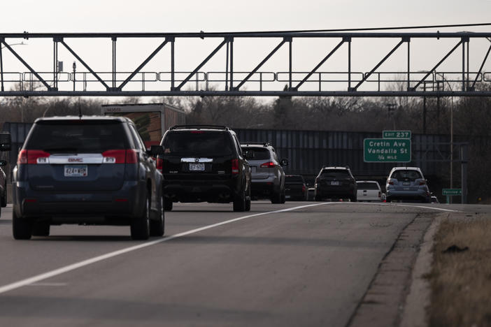 Vehicles drive on highway I-94 in St. Paul, Minn., on Nov. 7, 2020. A recent report from the International Energy Agency said emissions fell across most parts of the economy, with one notable exception: SUVs.