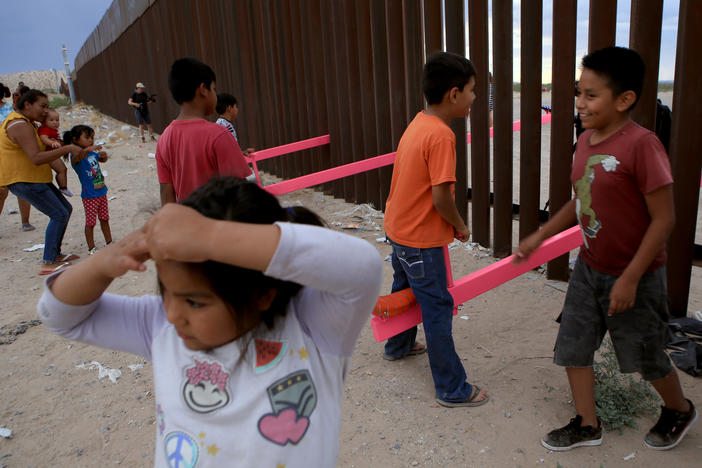 American and Mexican families play with a seesaw installation at the border near Ciudad Juarez, Mexico, in July 2019. London's Design Museum recognized the project with an award for best design of 2020.